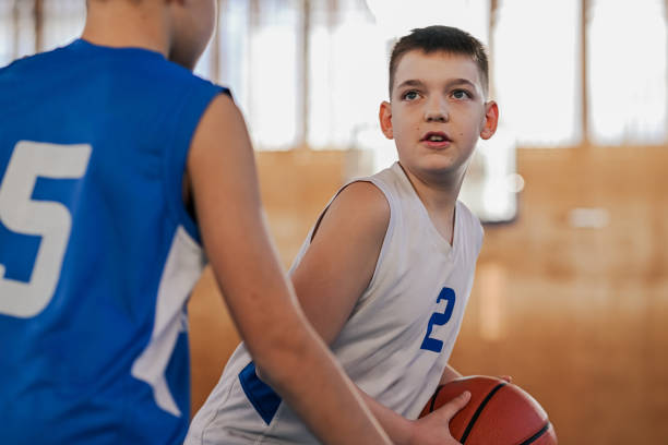 istock Defense at youth basketball game 2174042696