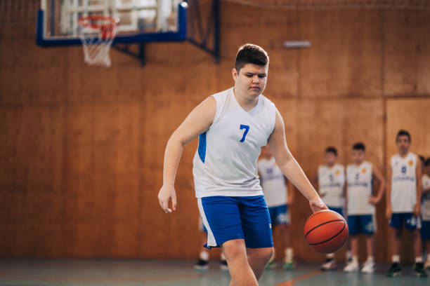 istock Focused boy playing basketball 2174042698