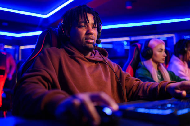 istock Focused interracial gamer with headset participating in mmo game. 2174042771