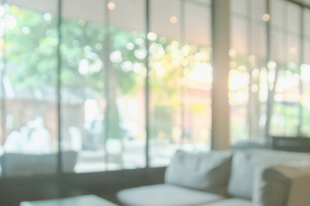 istock Abstract blur interior coffee shop or cafe for background. Blur restaurant interior banner. Hospital and clinic blurry with bokeh. Blurred windows green on garden outdoor and view of light living room 2174048688