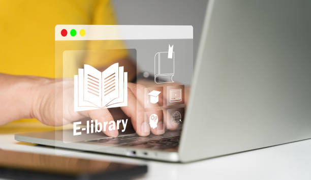 istock E-library concept. Man use a laptop with virtual Ebook icons for electronic books online 2174049038