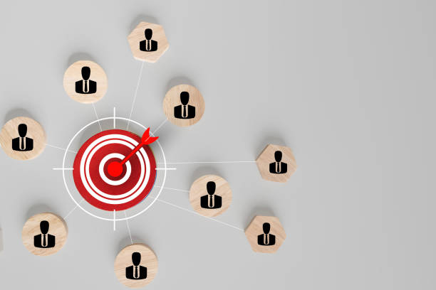 istock Customer relationship management concept. wooden block with target icon linked with human icons 2174049048