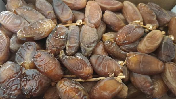 istock The surface texture of selected dried dates. Natural oriental sweets. 2174056450
