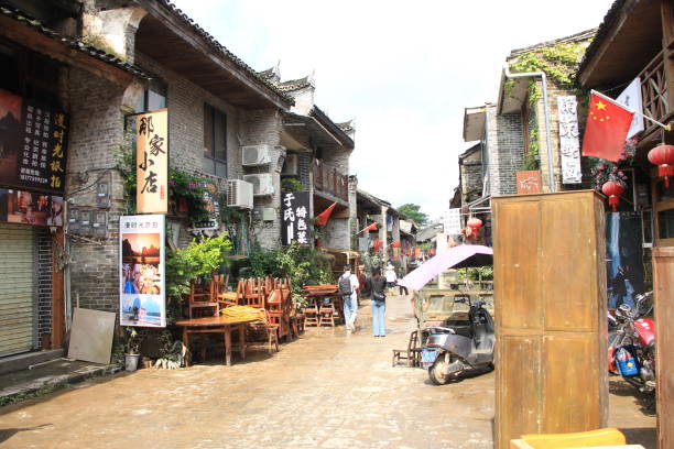 Yangshuo, China – June 21, 2024: Locals start clearing up the old town after serious flooding