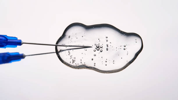 istock A drop of medicine flowing from a syringe with a needle. 2174068075