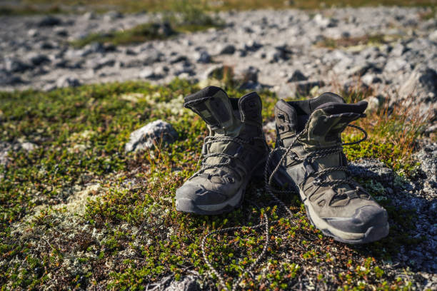 istock Hiking boots on the ground, active lifestyle concept 2174069989