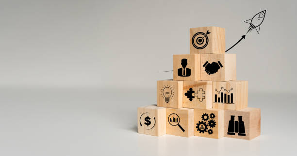 istock Rocket launching from wood cube with business icon, Start-up, Creativity, Big idea, Business goals management 2174072338