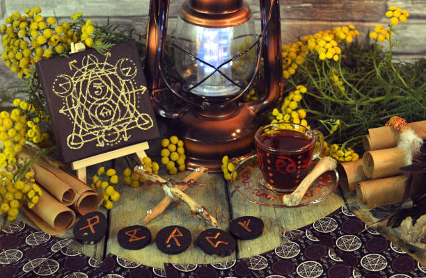 istock Mystic still life with tarot cards, lantern and witchy ritual objects on old altar table. Occult, esoteric, wicca, Halloween and gothic concept. No foreign language, all symbols are fictional 2174072871