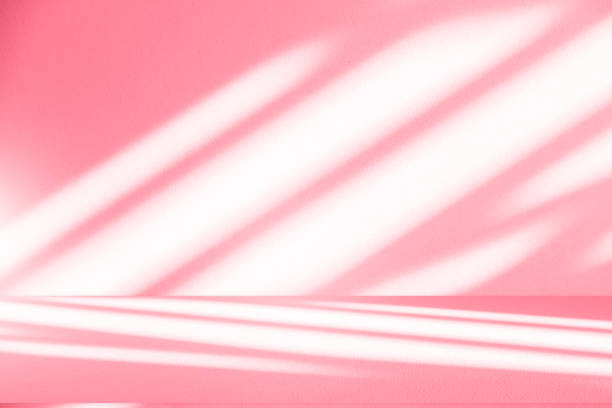 istock Wall interior background, studio, and backdrops show products. with shadow from window color white and pink light. background for text insertion and presentation of product 2174074672
