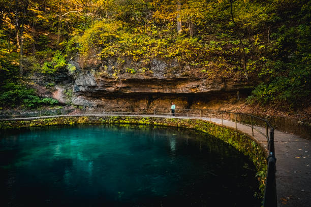 istock V10/iew of spring-fed pond in Midwestern park in fall 2174074703