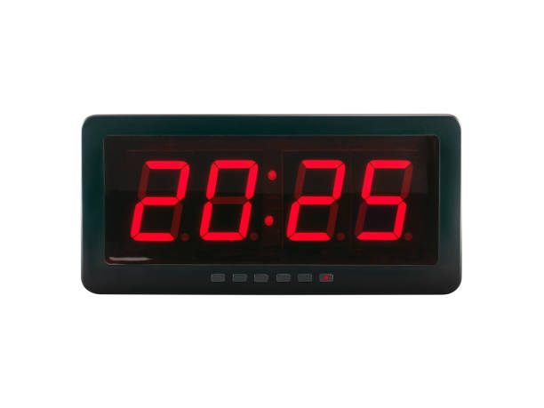 istock red number 2025 illumination on black digital electronic alarm clock screen isolated on white background 2174074833