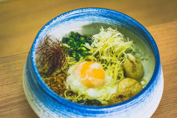 istock ramen Served cold in a bowl with seared scallops and soft boiled egg 2174076400