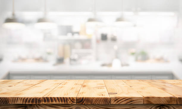 istock beautiful wood texture wood counter table top on blur white minimal kitchen background.For montage product display 2174080341