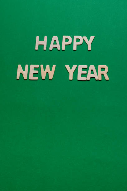 composition with happy new year isolated on a green background