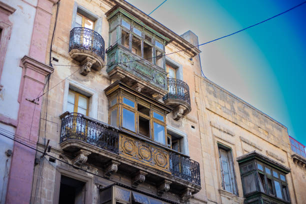 istock Old building ruined facade wall with closed wooden doors in Valletta, Malta 2174082548