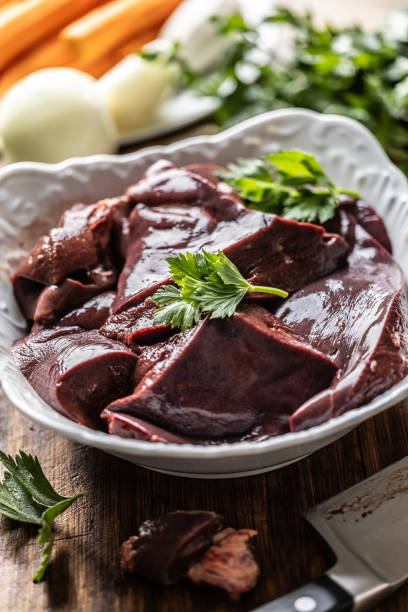 istock Sliced beef liver in a white bowl, ready to cook. 2174082983
