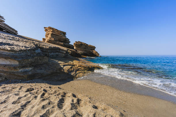 istock A beauriful sandy beach in front of an impressive rock formation at Triopetra beach in southern Crete under a clear blue sky 2174085615