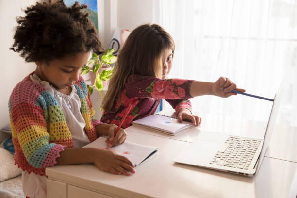 istock Two children engaged in creative drawing and online learning at home during the afternoon 2174087427