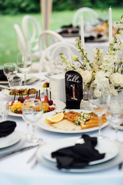 istock Luxurious restaurant. Luxurious interior, white tables, serving dishes and glasses for guests 2174087988