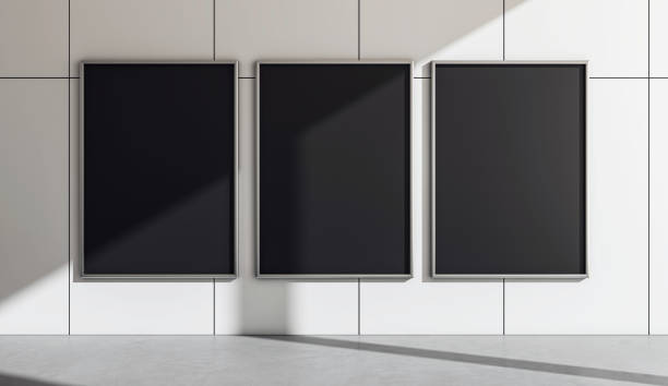 Three vertical black posters on a modern tiled wall in a well-lit area. 3D Rendering