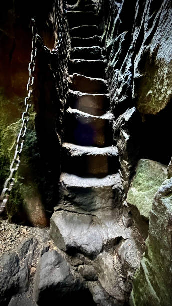 istock A narrow staircase rising from a cave to the exit. Table Mountains in Poland 2174090874