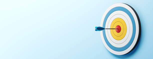 Dart hitting the bullseye of a colored dartboard on a blue background. 3D Rendering