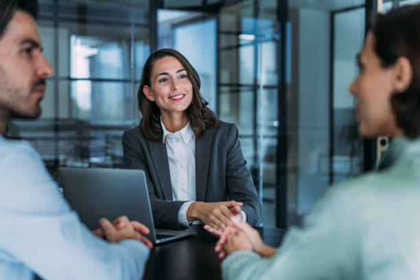 istock Group of business persons talking in the office. 2174096140