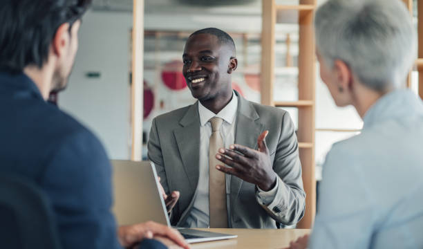 istock Group of business persons talking in the office. 2174096158
