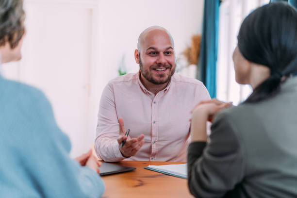 istock Group of business persons talking in the office. 2174096207