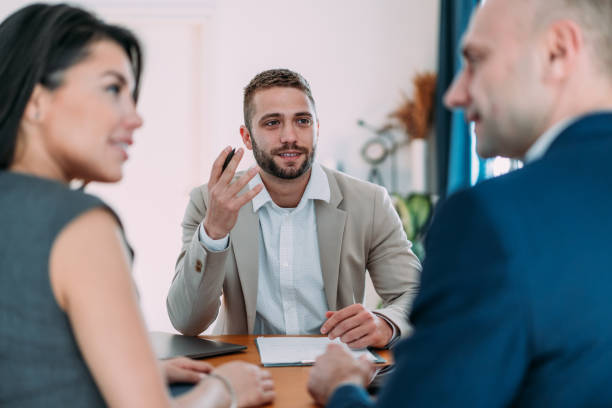 istock Group of business persons talking in the office. 2174096229