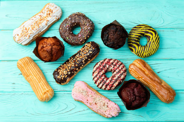 istock Mix of muffins ( cupcake ) chocolate , vanilla , berries . Top view 2174096905