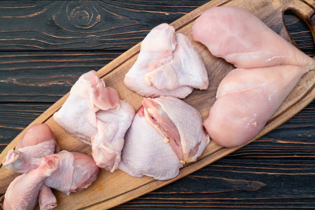 istock Raw mixed chicken meat parts  for cooking on rustic background 2174097046
