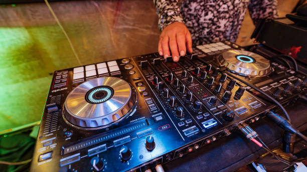 istock A DJ mixing a track on a turntable 2174098094