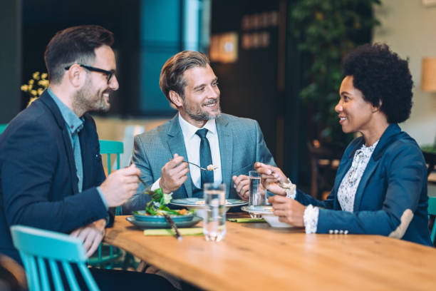 istock Business people having dinner together 2174098327