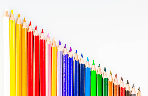 A row of colored pencils sitting next to each other