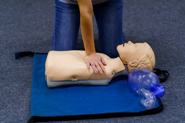 istock A dummy being placed on a blue mat. A Dummy on a Blue Mat, Symbolizing Practice, Training, and Preparation 2174101226