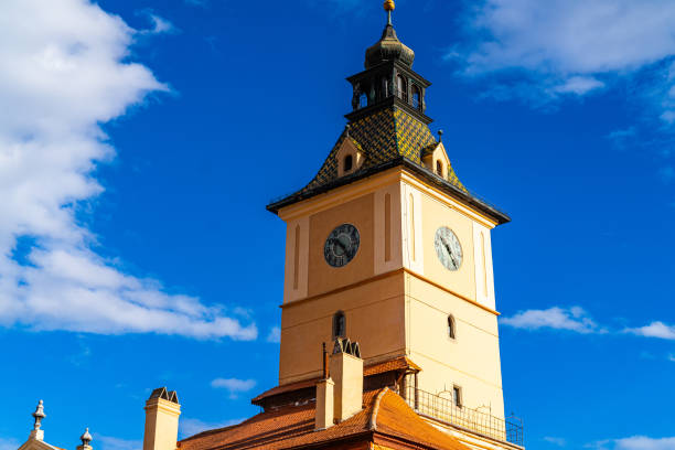 A tall clock tower with a sky background