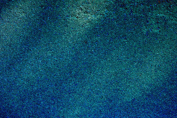 istock Green emerald sand spotted background with sunbeams 2174101623