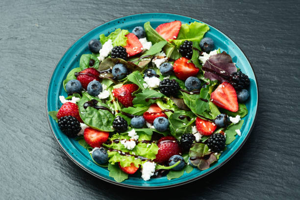 istock Berries salad (blueberry strawberry blackberry ) with cheese feta and balsamic sauce 2174103249