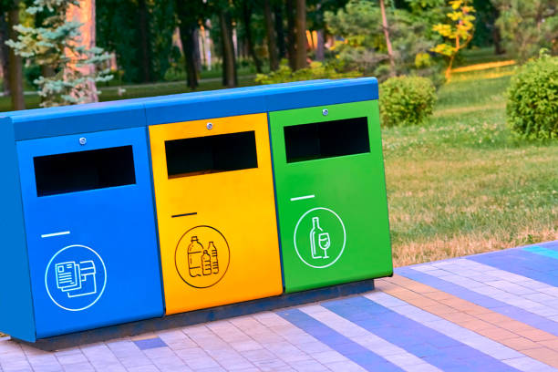 istock Ecology. Waste containers for plastic, paper and glass in a summer park 2174105205