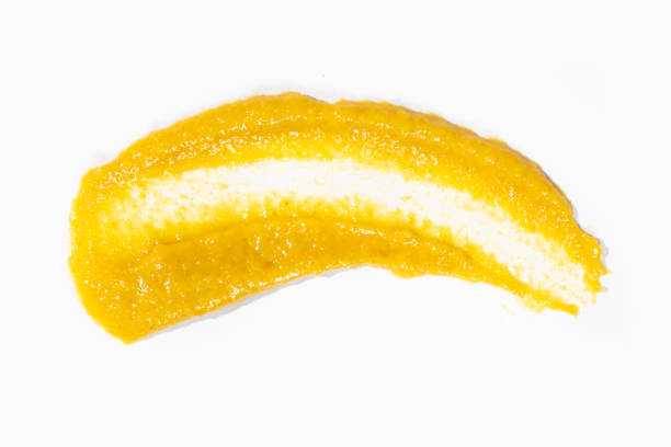 istock Smear of mustard sauce on white background isolate, creativity in cooking, macro texture 2174105486