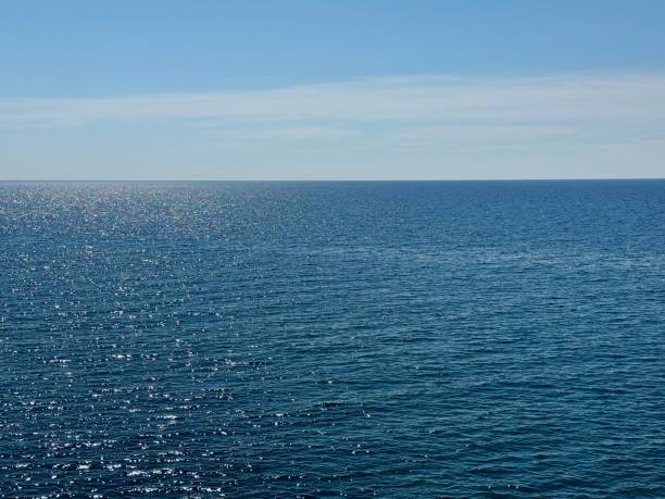 istock Sea blue shiny water and clear sunny sky. 2174106179