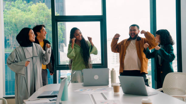 istock Group of Asian office workers dancing to stay active while having to work 9 to 5. 2174107332