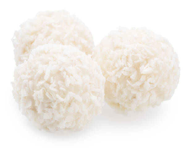 istock Round white chocolate candies covered with blanched coconut on white background. File contains clipping path. 2174107608