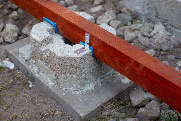 istock Wooden beam secured with metal bracket on concrete block 2174107941