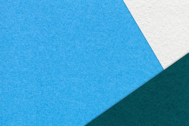 istock Texture craft blue paper background with white and emerald border. Vintage abstract turquoise cardboard. 2174109455