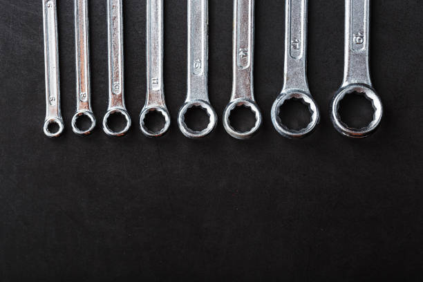 istock A set of wrenches in a row on a black background in a row. 2174109543