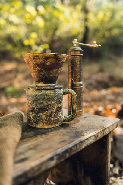 istock Rustic Coffee Setup with Ceramic Mug and Grinder Outdoors 2174110803