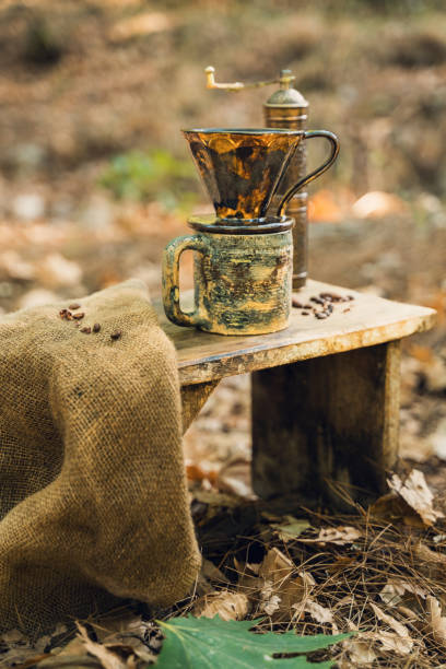 istock Rustic Coffee Mug and Grinder in Outdoor Setting 2174110864