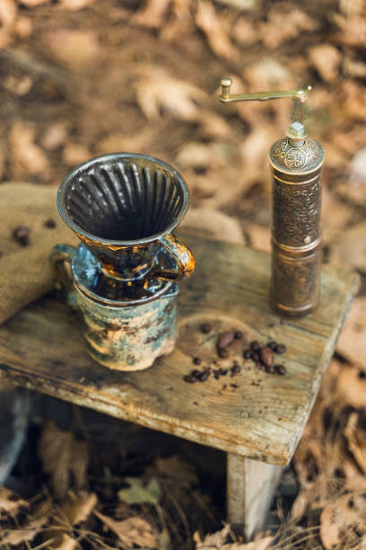 istock Handcrafted Ceramic Coffee Mug and Vintage Grinder 2174110870